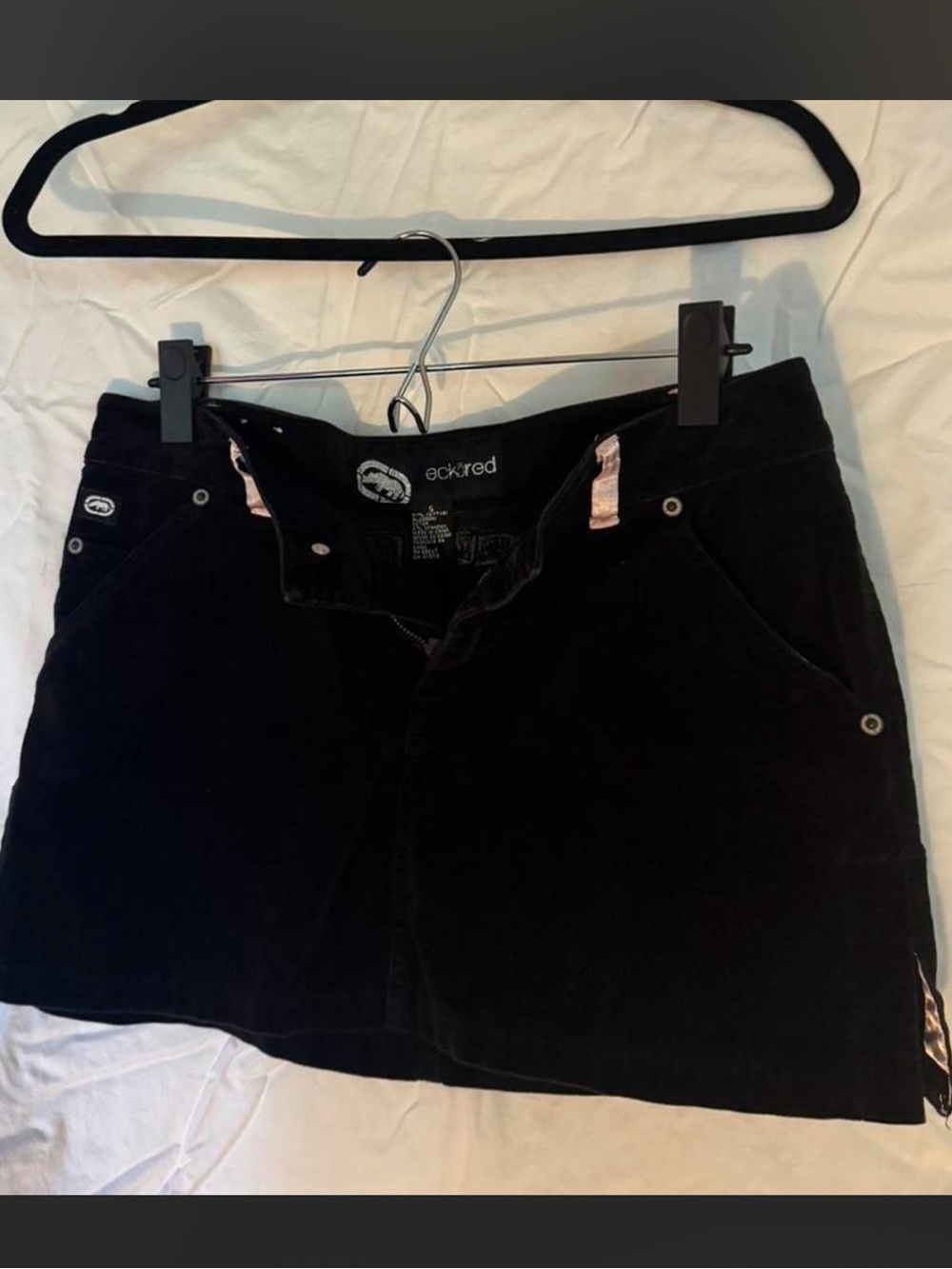 Ecko Unlimited Black Corduroy Mini Skirt with Subtle Pink Accents